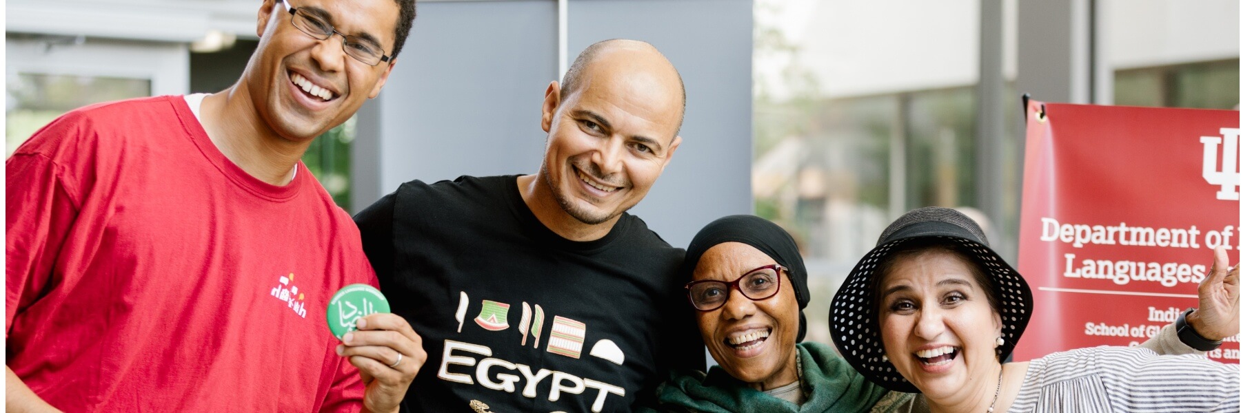 HLS faculty posing for the camera in the atrium.