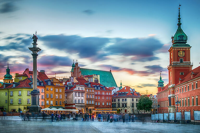 People in a town square in Warsaw, Poland.